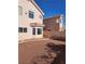 The backyard features a neutral color scheme, low maintenance landscaping, and privacy walls at 8788 Elise Ct, Henderson, NV 89074