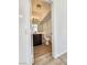 Well-lit half bathroom with wood-look flooring, dark vanity, and modern fixtures at 8788 Elise Ct, Henderson, NV 89074