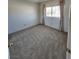 Clean, carpeted bedroom with a window at 8788 Elise Ct, Henderson, NV 89074