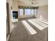 Bedroom with natural light, a ceiling fan, plush carpeting, and a fireplace at 8788 Elise Ct, Henderson, NV 89074