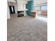 Open living room with fireplace leading to a spacious kitchen area at 8788 Elise Ct, Henderson, NV 89074