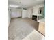 Spacious living room features carpet flooring and a cozy fireplace at 8788 Elise Ct, Henderson, NV 89074