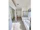 Bright main bathroom features a tub, walk-in shower, and double vanity at 8788 Elise Ct, Henderson, NV 89074