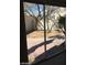 Cozy backyard view from sliding glass doors featuring desert landscaping at 8829 Cornwall Glen Ave, Las Vegas, NV 89129