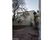 Private backyard featuring a stamped concrete patio and mature landscaping with palm trees at 8829 Cornwall Glen Ave, Las Vegas, NV 89129