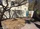 View of a backyard with a concrete block privacy wall and desert landscaping at 8829 Cornwall Glen Ave, Las Vegas, NV 89129