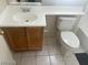 Bright bathroom with a sink, light wood cabinet and a white toilet at 8829 Cornwall Glen Ave, Las Vegas, NV 89129