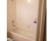 Bathroom view of a white tiled shower and tub with silver fixtures at 8829 Cornwall Glen Ave, Las Vegas, NV 89129