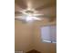 Bedroom with a ceiling fan and window at 8829 Cornwall Glen Ave, Las Vegas, NV 89129