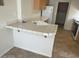 Bright kitchen featuring tile countertops, wooden cabinets, and appliances at 8829 Cornwall Glen Ave, Las Vegas, NV 89129