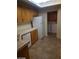 Kitchen shot showcasing wooden cabinets, tiled countertops, and stainless steel dishwasher at 8829 Cornwall Glen Ave, Las Vegas, NV 89129
