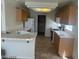 Bright kitchen featuring tile countertops, wooden cabinets, and appliances at 8829 Cornwall Glen Ave, Las Vegas, NV 89129