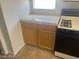 Close up of the gas range and tiled countertop in the kitchen at 8829 Cornwall Glen Ave, Las Vegas, NV 89129