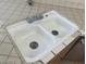 Kitchen sink features a dual basin layout and stainless steel faucet at 8829 Cornwall Glen Ave, Las Vegas, NV 89129