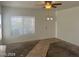 Bright living room with a large window, neutral walls, and ready for your personal touch at 8829 Cornwall Glen Ave, Las Vegas, NV 89129
