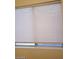 Window with white blinds allowing natural light at 8829 Cornwall Glen Ave, Las Vegas, NV 89129