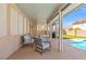 Relax under the covered patio with a pool and outdoor furniture, perfect for entertaining at 885 Violet Hill St, Las Vegas, NV 89110