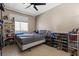 Neutral bedroom features modern ceiling fan, plentiful storage, and window for natural light at 885 Violet Hill St, Las Vegas, NV 89110
