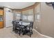 Kitchen nook features a breakfast table set beneath large windows for natural light and views at 885 Violet Hill St, Las Vegas, NV 89110