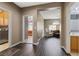 Wide hallway showcases hardwood floors and access to the laundry room, bedrooms, living room and bathroom at 885 Violet Hill St, Las Vegas, NV 89110