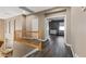 Upstairs hallway features hardwood floors and natural wood banister with views into other rooms at 885 Violet Hill St, Las Vegas, NV 89110