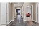 Open hallway with hardwood floors provides passage to bedrooms and living spaces at 885 Violet Hill St, Las Vegas, NV 89110