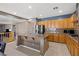Spacious kitchen features an island with stainless steel sink and eat-in counter plus plenty of cabinetry at 885 Violet Hill St, Las Vegas, NV 89110
