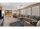Spacious living room open to kitchen has neutral paint and sliding glass doors to the backyard at 885 Violet Hill St, Las Vegas, NV 89110