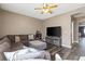 Comfortable living room features hardwood floors, large sectional, and neutral decor at 885 Violet Hill St, Las Vegas, NV 89110