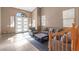 Bright living room featuring high ceilings, natural light, and elegant tile flooring at 885 Violet Hill St, Las Vegas, NV 89110