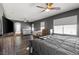 Spacious main bedroom includes hardwood floors, ceiling fan, two windows and an entertainment center at 885 Violet Hill St, Las Vegas, NV 89110