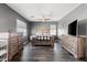 The main bedroom includes hardwood floors, natural light, two large dressers, and a ceiling fan at 885 Violet Hill St, Las Vegas, NV 89110