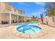 Inviting pool and spa with a covered patio, great for entertaining guests and enjoying the outdoors at 885 Violet Hill St, Las Vegas, NV 89110