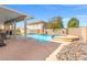 Inviting backyard featuring a refreshing pool, spa, and covered patio for relaxing and entertaining at 885 Violet Hill St, Las Vegas, NV 89110