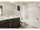 Bathroom featuring a double sink vanity, shower with a curtain, and tiled floors at 8929 Sleepy Panda Ave, Las Vegas, NV 89148