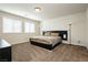 Large bedroom with carpet, a bed with side tables, and natural light from a window at 8929 Sleepy Panda Ave, Las Vegas, NV 89148