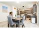 Cozy dining area with modern lighting, views of the kitchen, and room to gather at 8929 Sleepy Panda Ave, Las Vegas, NV 89148