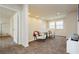 Upstairs hallway featuring carpeted floors, two chairs and lots of natural light at 8929 Sleepy Panda Ave, Las Vegas, NV 89148