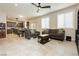 Spacious living area with large windows, tile flooring, and views into the kitchen and dining area at 8929 Sleepy Panda Ave, Las Vegas, NV 89148