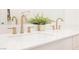 Modern bathroom featuring double sinks and sleek white countertops at 8968 Skye Treeline St, Las Vegas, NV 89166