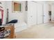 Bright bedroom features white walls, trim, and carpet, plus a daybed and modern artwork at 8968 Skye Treeline St, Las Vegas, NV 89166