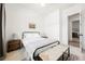 Cozy bedroom with a metal frame bed and woven bench at 8968 Skye Treeline St, Las Vegas, NV 89166