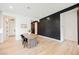 Minimalist Dining room with wood accent wall at 8968 Skye Treeline St, Las Vegas, NV 89166