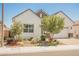 Attractive home with a two-car garage, desert landscaping, and attractive architectural details at 8968 Skye Treeline St, Las Vegas, NV 89166
