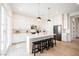 Modern kitchen featuring a center island with bar seating, stainless appliances, and stylish pendant lighting at 8968 Skye Treeline St, Las Vegas, NV 89166