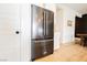Stainless steel french door refrigerator and white cabinets at 8968 Skye Treeline St, Las Vegas, NV 89166