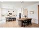 Open-concept kitchen with a large center island, modern lighting, and stainless steel appliances at 8968 Skye Treeline St, Las Vegas, NV 89166