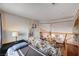 Second floor bedroom boasts hardwood floors with decorative accents and natural light at 8983 Emerald Waters Ct, Las Vegas, NV 89147
