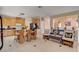 Open concept living space includes a kitchen, dining area, and a comfortable seating area at 8983 Emerald Waters Ct, Las Vegas, NV 89147