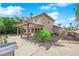 Backyard with an outdoor seating area and a large concrete patio at 9021 Feather River Ct, Las Vegas, NV 89117